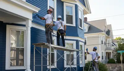 Boston, MA painting contractor on a residential exterior project, delivering professional house painting services